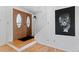 Bright entryway featuring hardwood floors, decorative art, and a staircase at 12979 W Ohio Ave, Lakewood, CO 80228