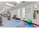 Modern gym with various exercise equipment and ample space for a complete workout routine at 12979 W Ohio Ave, Lakewood, CO 80228