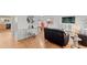 Open-concept living room with hardwood floors and bright natural lighting at 12979 W Ohio Ave, Lakewood, CO 80228