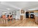 Spacious open layout combines the living room, dining area, and kitchen with hardwood floors at 12979 W Ohio Ave, Lakewood, CO 80228