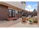 Charming patio featuring cozy seating, brick accents, and a relaxing outdoor living space at 12979 W Ohio Ave, Lakewood, CO 80228