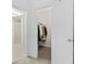 Walk-in closet with ample hanging space and modern organizational system at 12979 W Ohio Ave, Lakewood, CO 80228