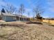 Large backyard with a patio area, perfect for outdoor entertaining and relaxation at 6650 Depew Ct, Arvada, CO 80003