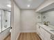 Modern bathroom with a shower and a double vanity featuring contemporary fixtures at 6650 Depew Ct, Arvada, CO 80003