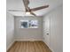Cozy bedroom with neutral walls, wood flooring, and a ceiling fan for added comfort at 6650 Depew Ct, Arvada, CO 80003