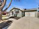 Well-maintained home with attached garage, paved driveway, and fresh exterior paint at 6650 Depew Ct, Arvada, CO 80003