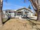 Charming single-story home with a well-manicured lawn and mature trees at 6650 Depew Ct, Arvada, CO 80003