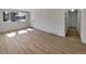 Inviting living room with wood floors and a large window offering pleasant views at 6650 Depew Ct, Arvada, CO 80003