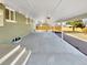 Spacious covered patio with concrete flooring and brick accents, ideal for outdoor entertaining and relaxation at 6650 Depew Ct, Arvada, CO 80003