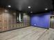 Finished basement with vinyl flooring, unique wallpaper and a pop of color at 6943 Oak Way, Arvada, CO 80004