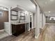 Finished basement with a wet bar, dark cabinets, and a beverage cooler, great for entertaining at 6943 Oak Way, Arvada, CO 80004