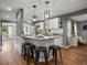Kitchen with granite countertops, a breakfast bar with seating, and stainless steel appliances at 6943 Oak Way, Arvada, CO 80004