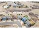 An aerial view showcases several suburban homes on a cul-de-sac street surrounded by natural open spaces at 1022 Orion Way, Castle Rock, CO 80108