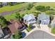 An aerial view of a home in a suburban neighborhood, surrounded by well-manicured lawns and mature trees at 1022 Orion Way, Castle Rock, CO 80108