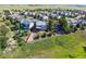 Expansive aerial view of a neighborhood with lush greenery and well-maintained homes at 1022 Orion Way, Castle Rock, CO 80108
