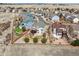 Aerial view displays backyard with well-designed outdoor living space, complemented by lush landscaping and a privacy fence at 1022 Orion Way, Castle Rock, CO 80108