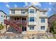 A backyard has a deck, patio, and mature landscaping offering amazing space for outdoor living and entertaining at 1022 Orion Way, Castle Rock, CO 80108