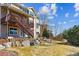 A backyard has a wooden deck, stone accents, beautiful steps, and privacy fence offering amazing space for outdoor living at 1022 Orion Way, Castle Rock, CO 80108