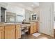 Bathroom featuring double sinks, a vanity, and natural light from a glass block window at 1022 Orion Way, Castle Rock, CO 80108