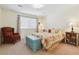 Bedroom with patterned bedding and an upholstered accent chair at 1022 Orion Way, Castle Rock, CO 80108