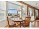 Sun-filled breakfast nook with large windows and a view of the backyard at 1022 Orion Way, Castle Rock, CO 80108