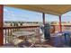 Enjoy outdoor dining on the covered deck with a view, complete with a grill for easy entertaining at 1022 Orion Way, Castle Rock, CO 80108