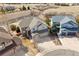 An aerial view of an impressive home showcasing stone accents and a three-car garage in a well-kept neighborhood at 1022 Orion Way, Castle Rock, CO 80108