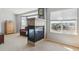 Modern fireplace with a tiled surround and black frame, offering a view of the neighborhood at 1022 Orion Way, Castle Rock, CO 80108