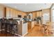Light-filled kitchen with granite countertops, stainless appliances, and breakfast bar seating at 1022 Orion Way, Castle Rock, CO 80108