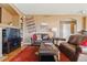Cozy living room with comfortable leather seating, a decorative rug, and stylish accents at 1022 Orion Way, Castle Rock, CO 80108