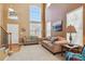Inviting living room with high ceilings, lots of natural light, and neutral decor at 1022 Orion Way, Castle Rock, CO 80108