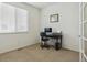 Minimalist office space with natural light and a functional desk setup at 1022 Orion Way, Castle Rock, CO 80108