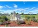 Beautiful park entrance with lush landscaping, vibrant flowers, and welcoming signage for community enjoyment and relaxation at 1022 Orion Way, Castle Rock, CO 80108