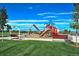 Vibrant community playground featuring swings, slides, and various play structures for active play and entertainment at 1022 Orion Way, Castle Rock, CO 80108