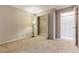 The bedroom features neutral walls, carpet, a closet, and overhead lighting at 9402 W 89Th Cir, Broomfield, CO 80021