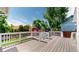Spacious deck overlooking a backyard with a charming red barn, perfect for outdoor entertaining and relaxation at 10635 Dexter Dr, Thornton, CO 80233