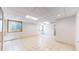Spacious basement with tiled floors and natural light from windows, ready for customization and various uses at 10635 Dexter Dr, Thornton, CO 80233
