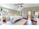 Spacious bedroom with high ceilings, hardwood floors, two windows and an opening view to the bath at 10635 Dexter Dr, Thornton, CO 80233