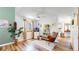 Open living space featuring a comfortable chair, bright windows, and modern decor at 10635 Dexter Dr, Thornton, CO 80233
