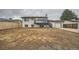 Exterior view of a home with a deck, garage, and spacious backyard at 1152 S Salida Way, Aurora, CO 80017