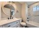 Bathroom features modern fixtures, a decorative mirror and a tub-shower with marble-style tile at 1152 S Salida Way, Aurora, CO 80017
