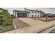 View of the home, driveway, and lawn, offering a glimpse of the property's curb appeal at 1152 S Salida Way, Aurora, CO 80017