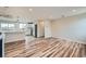Hardwood flooring complements the open living space flowing into the kitchen, perfect for entertaining at 1152 S Salida Way, Aurora, CO 80017