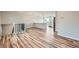 Open-concept living room featuring hardwood floors and natural light with a view into the kitchen at 1152 S Salida Way, Aurora, CO 80017