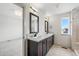 This bathroom features dual sinks with modern lighting at 260 E 4Th St, Berthoud, CO 80513