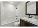 This bathroom features a shower over tub and modern vanity at 260 E 4Th St, Berthoud, CO 80513