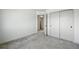 This bedroom features neutral carpet, closet and en-suite bathroom at 260 E 4Th St, Berthoud, CO 80513