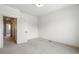 This bedroom features neutral carpet, and a view to en-suite bathroom at 260 E 4Th St, Berthoud, CO 80513