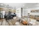Open-concept dining room connected to a modern kitchen with stainless steel appliances at 260 E 4Th St, Berthoud, CO 80513