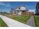 Well maintained homes with manicured lawn and flower garden at 260 E 4Th St, Berthoud, CO 80513